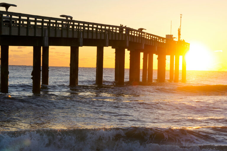 A,Spectacular,Sunrise,Over,The,Ocean,Behind,The,Pier,In Top Ten Beaches in St Johns County!